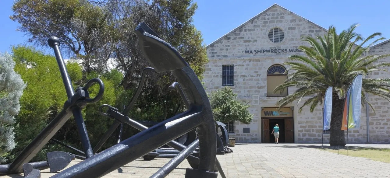 A large historic anchor outside the stone WA Shipwrecks Museum in Fremantle