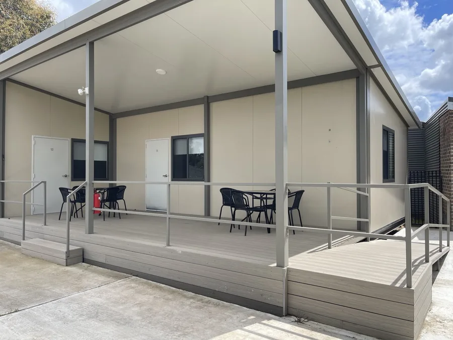 Covered deck with ramp access outside rooms 11 and 12