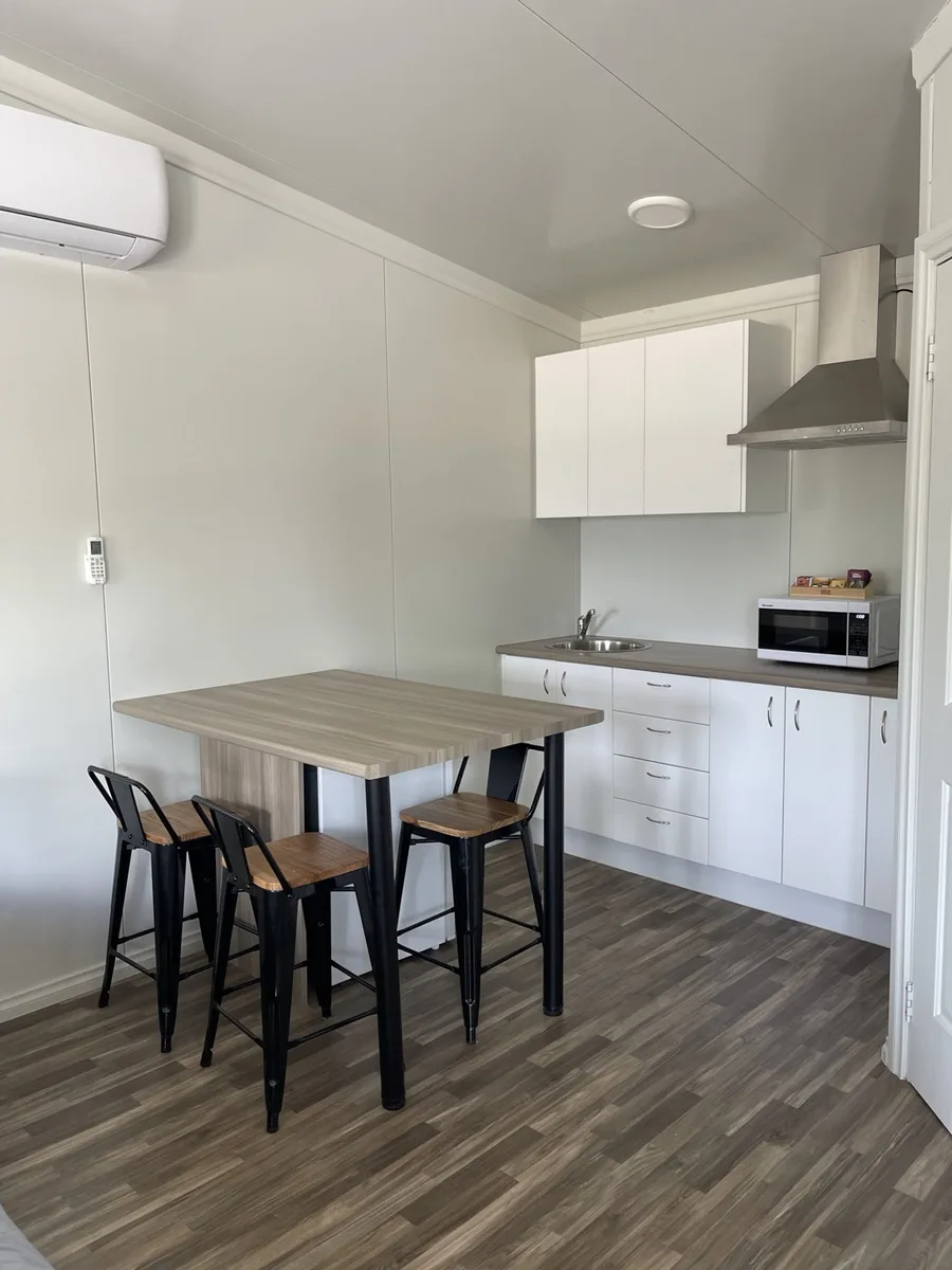 Kitchenette with breakfast bar and stools