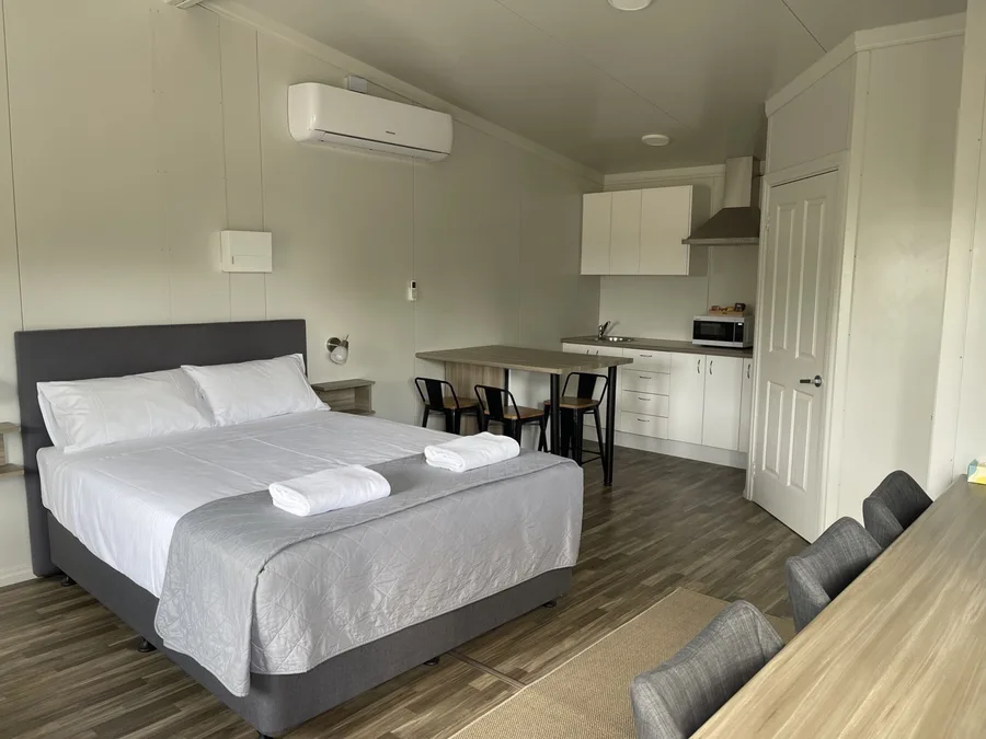 Self-contained unit at Cornwall House Accommodation with queen bed and kitchenette